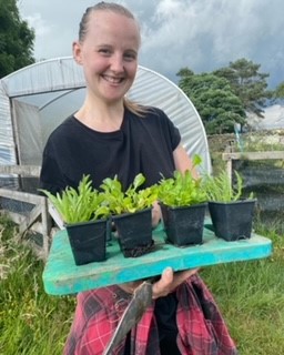 Student showing her planting
