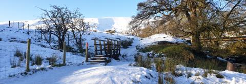 Snowboots and Shades up Pendle Hill.  © Carolyn Raw 