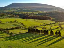Long shadows bring drama to a brooding Pendle Hill late afternoon on an Autumn day © Dave Spellman