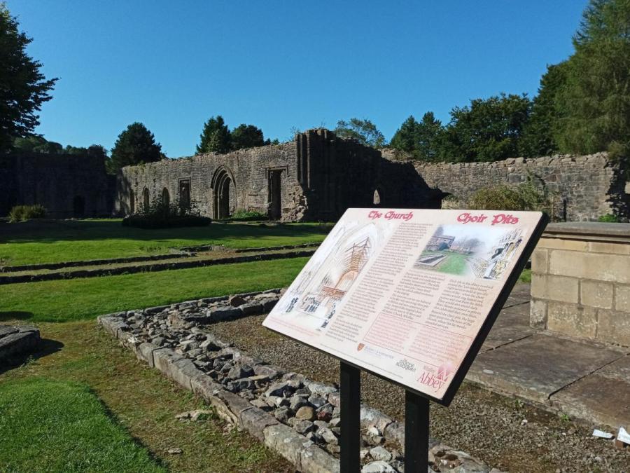 Whalley abbey and interpretation panel